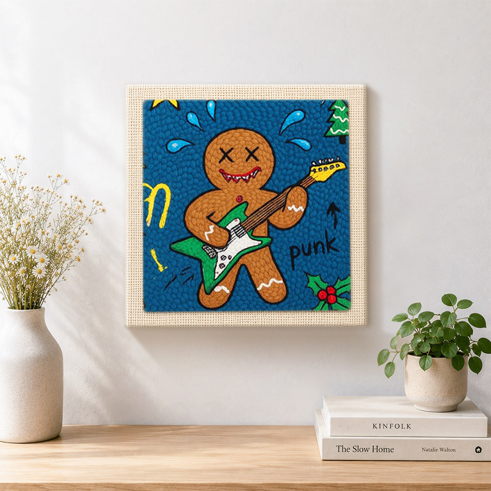 Finished punk gingerbread man playing guitar artwork displayed on a wall