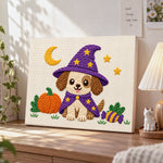 Puppy witch for halloween punch needle artwork displayed on a table
