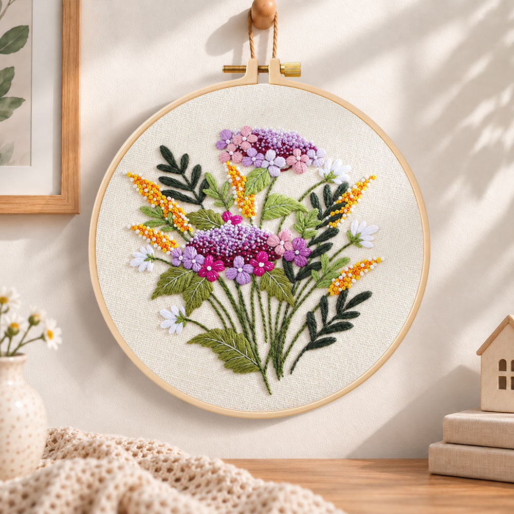 Purple and gold sprigs embroidery hoop wall art displayed as warm and cozy handmade home decor