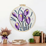 Finished purple and yellow tulip blooms artwork displayed on a wall