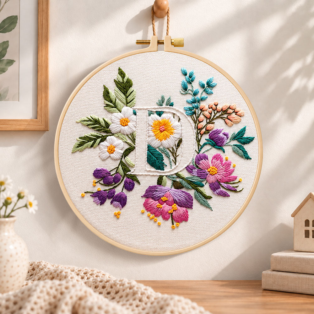 Purple daisy garden and letter d embroidery hoop wall art displayed as warm and cozy handmade home decor