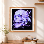 Finished purple floral dark skull art cross stitch artwork displayed as home decor