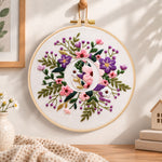 Purple floral ring and letter o embroidery hoop wall art displayed as warm and cozy handmade home decor