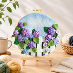 Finished purple hydrangeas on fence needle felting displayed on a wooden easel
