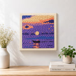 Finished purple lake and little boat artwork displayed on a wall