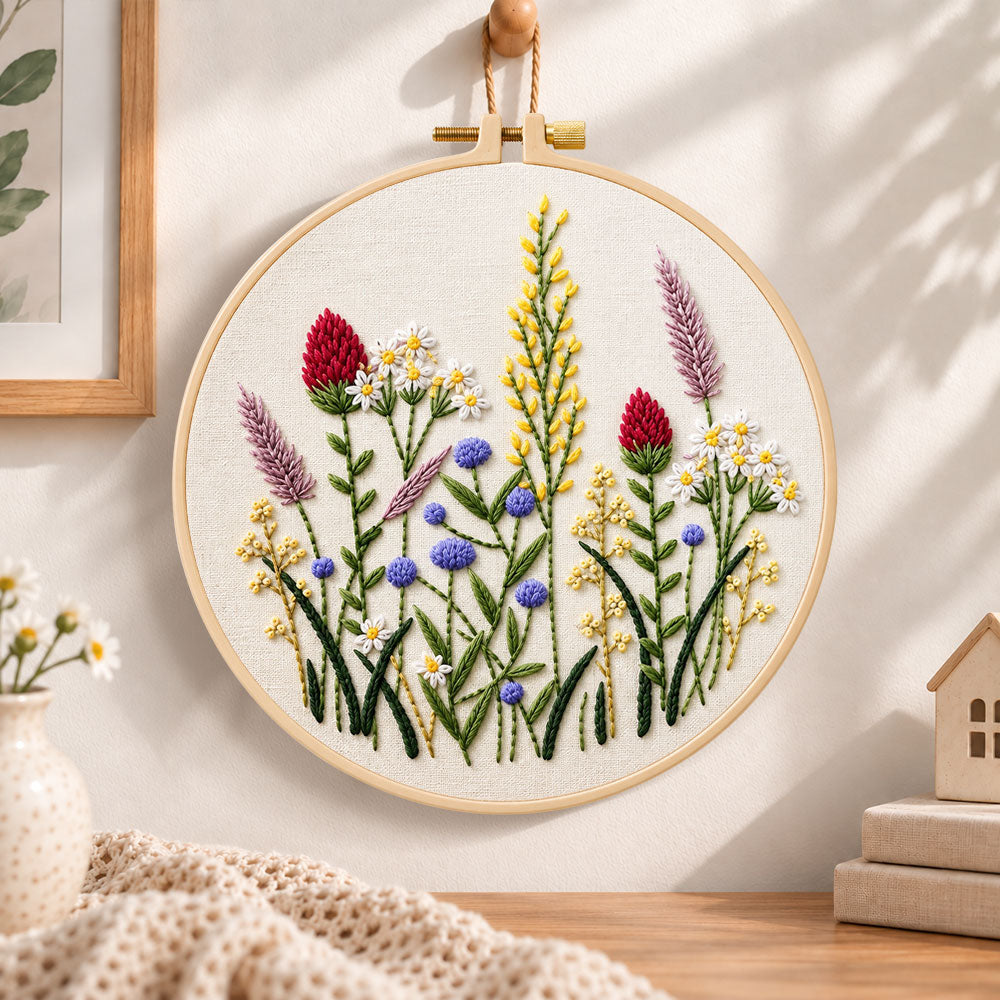 Purple meadow wildflower embroidery hoop wall art displayed as warm and cozy handmade home decor