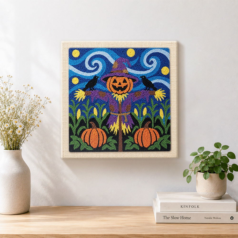 Finished purple outfit scarecrow artwork displayed on a wall