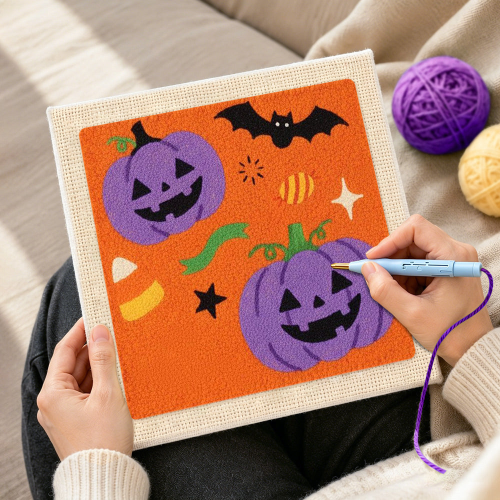 Creating handmade purple pumpkin and bat punch needle artwork