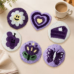 Purple smiley flower, butterfly and heart punch needle coasters used for home decoration