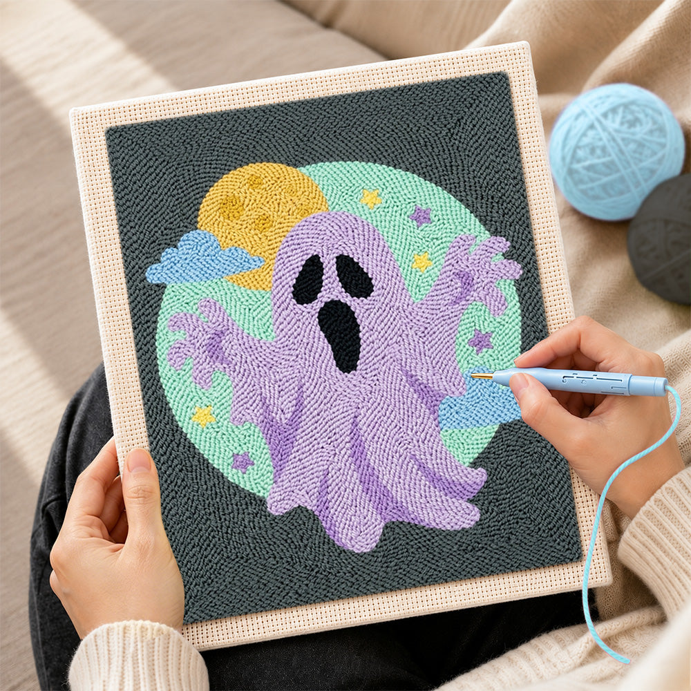 Creating handmade purple spooky ghost punch needle artwork