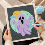 Creating handmade purple spooky ghost punch needle artwork