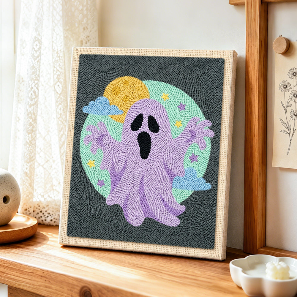 Purple spooky ghost punch needle artwork displayed on a table