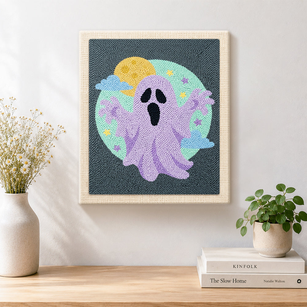 Finished purple spooky ghost artwork displayed on a wall
