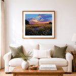 Finished purple sunset over wildflower meadow cross stitch artwork displayed as home decor