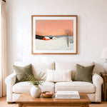 Finished quiet snowy countryside cross stitch artwork displayed as home decor