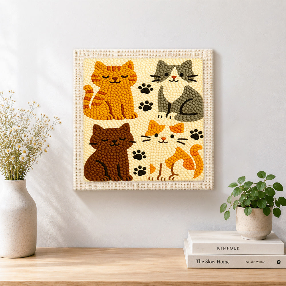 Finished quirky multi-colored kitty artwork displayed on a wall