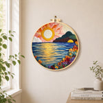 Radiant sun, blooming roses and blue waves needle felt wall art displayed in a bright home interior