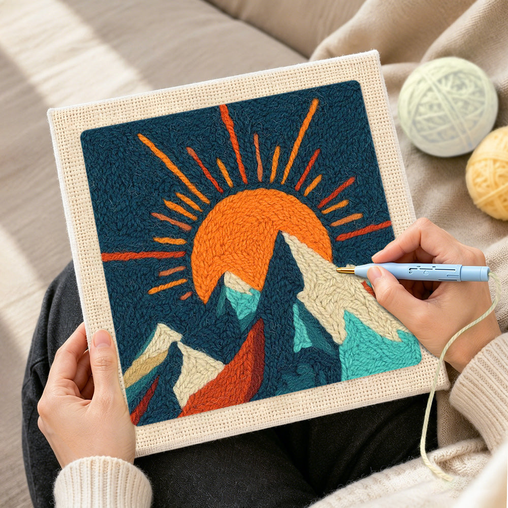 Creating handmade radiant sunburst and snowy peaks punch needle artwork
