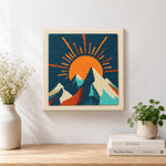 Finished radiant sunburst and snowy peaks artwork displayed on a wall