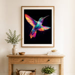 Finished rainbow hummingbird cross stitch artwork displayed as home decor