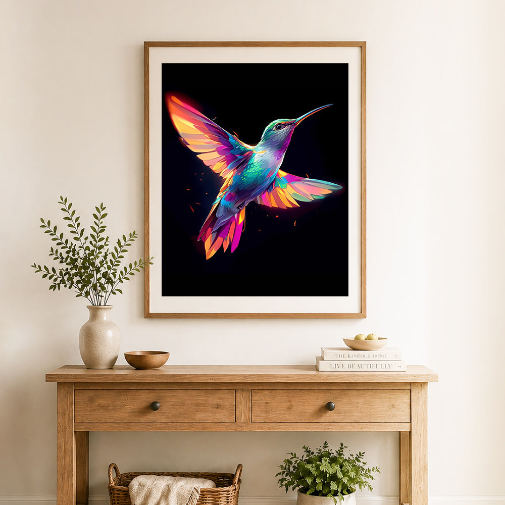 Finished rainbow hummingbird cross stitch artwork displayed as home decor
