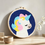 Rainbow mane unicorn punch needle artwork displayed on a table