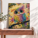 Finished rainbow pearl owl on branch pearl diamond painting artwork displayed as home decor