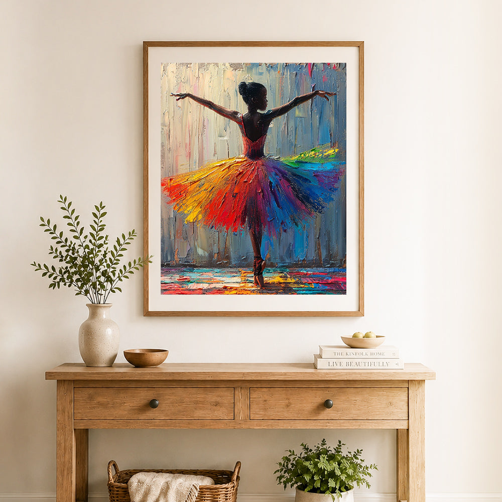 Finished rainbow tutu dancer cross stitch artwork displayed as home decor