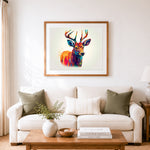 Finished rainbow watercolor deer cross stitch artwork displayed as home decor