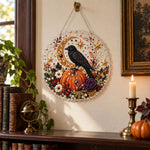 Finished raven pumpkin moon fall wreath pearl diamond painting artwork displayed as holiday home decor