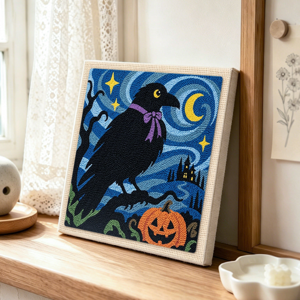 Raven with halloween night punch needle artwork displayed on a table