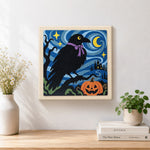 Finished raven with halloween night artwork displayed on a wall