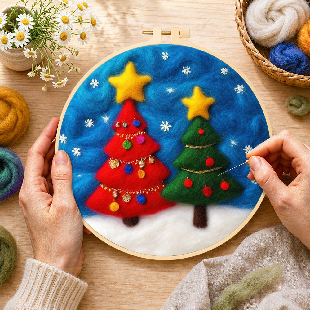Creating the red and green christmas trees with snowflakes wool painting by hand with a felting needle