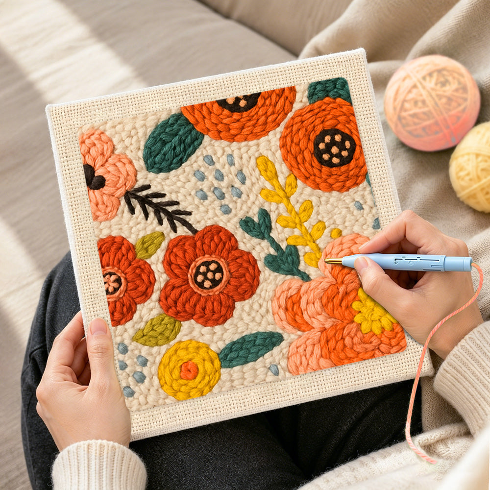 Creating handmade red and orange flowers punch needle artwork