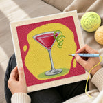 Creating handmade red cocktail with lime punch needle artwork
