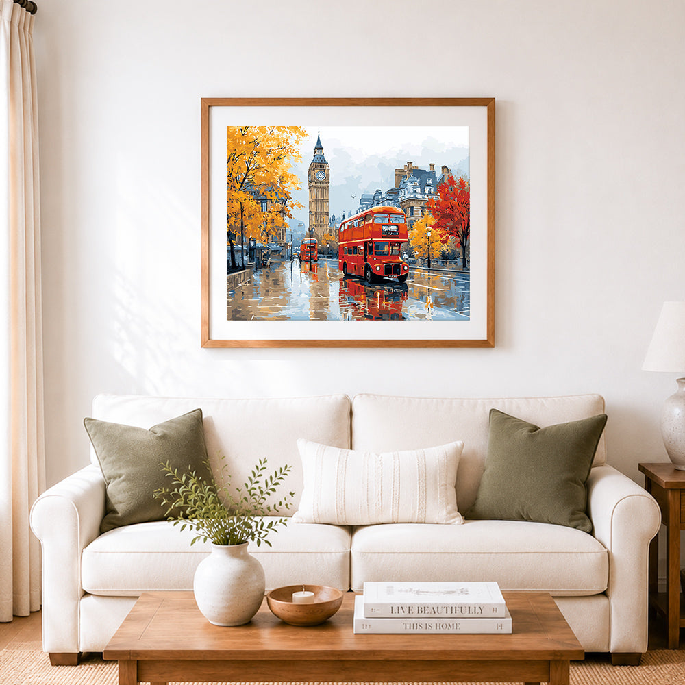 Finished red double decker bus in rainy london cross stitch artwork displayed as home decor