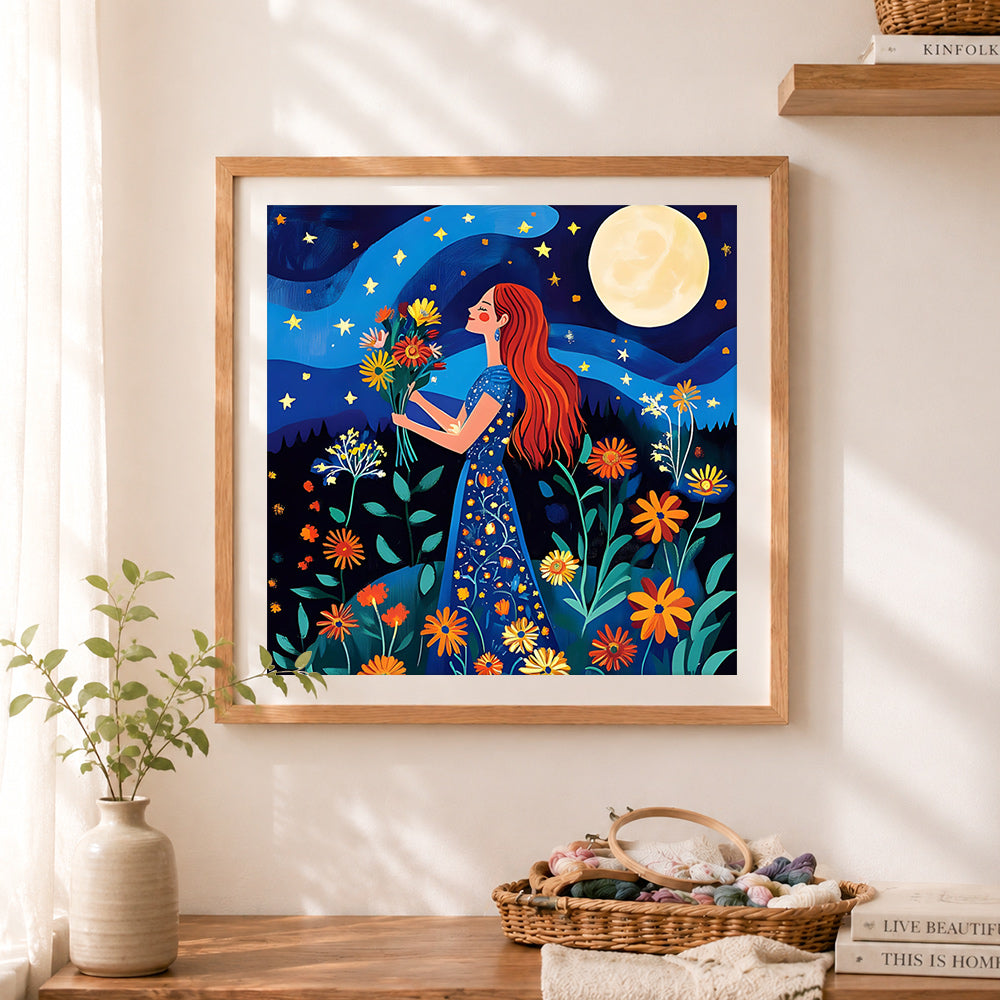 Finished red-haired woman holding flowers in moonlight cross stitch artwork displayed as home decor