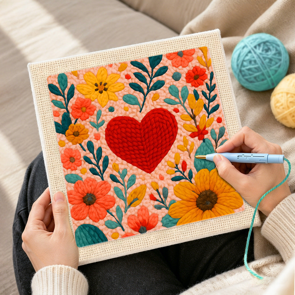 Creating handmade red heart surrounded by colorful blooms punch needle artwork