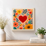 Finished red heart surrounded by colorful blooms artwork displayed on a wall