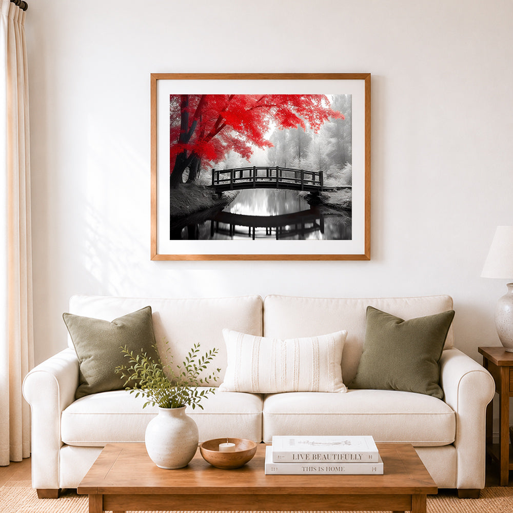 Finished red maple over gray tone water bridge cross stitch artwork displayed as home decor