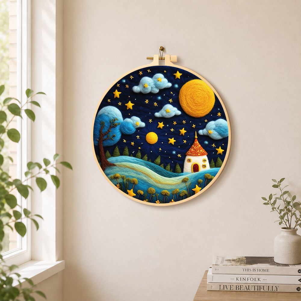Red-roof fairy house under the magical night sky needle felt wall art displayed in a bright home interior