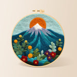 Red sun over snowy peaks needle felting kit for beginners with a round wooden frame