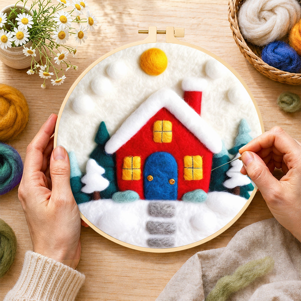 Creating the ed winter house with blue door wool painting by hand with a felting needle