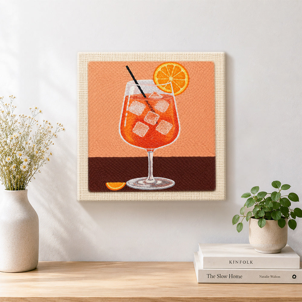 Finished refreshing orange cocktail with ice cubes artwork displayed on a wall