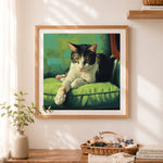 Finished relaxing cat on green sofa cross stitch artwork displayed as home decor