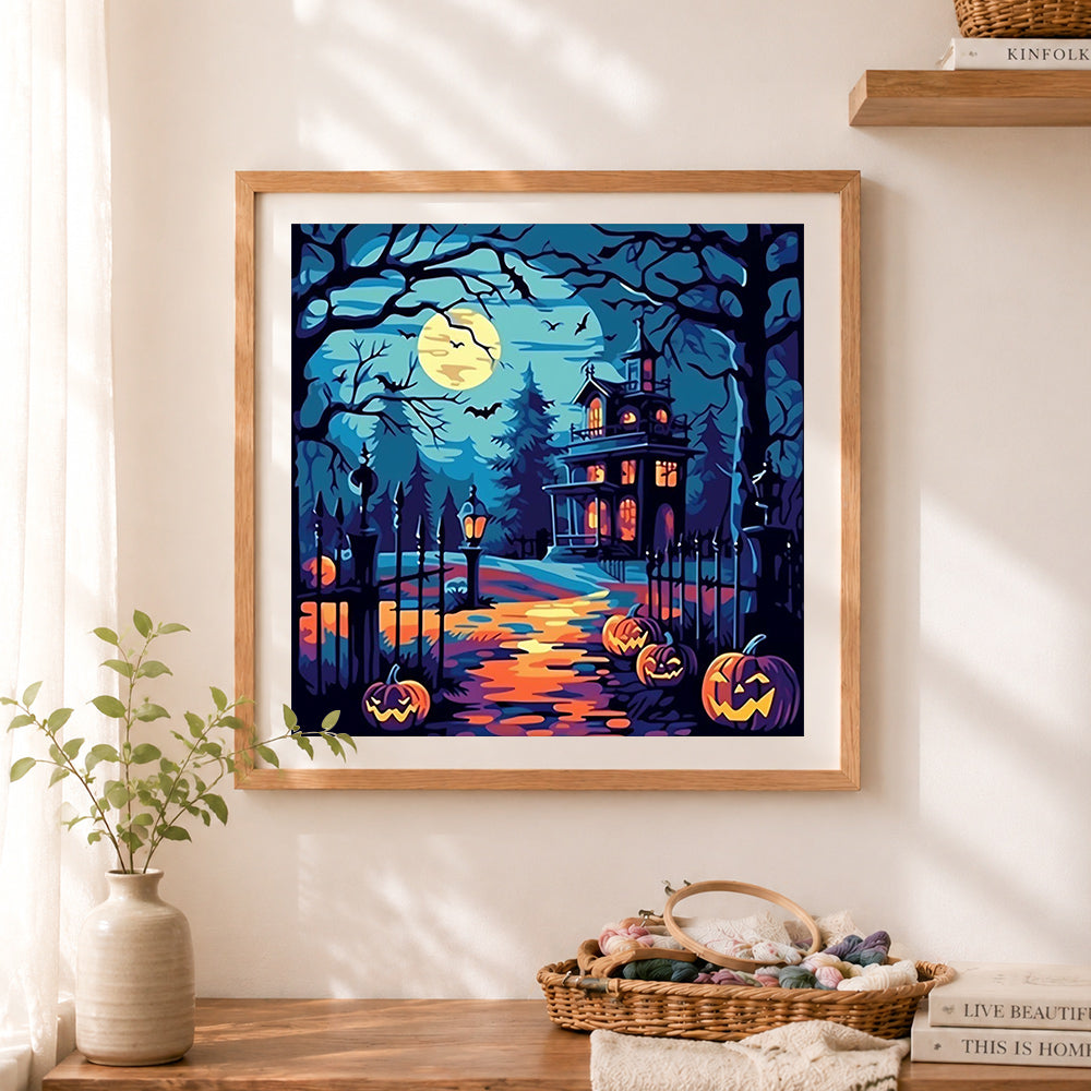 Finished retro halloween manor cross stitch artwork displayed as home decor