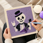 Creating handmade rocker skeleton punch needle artwork