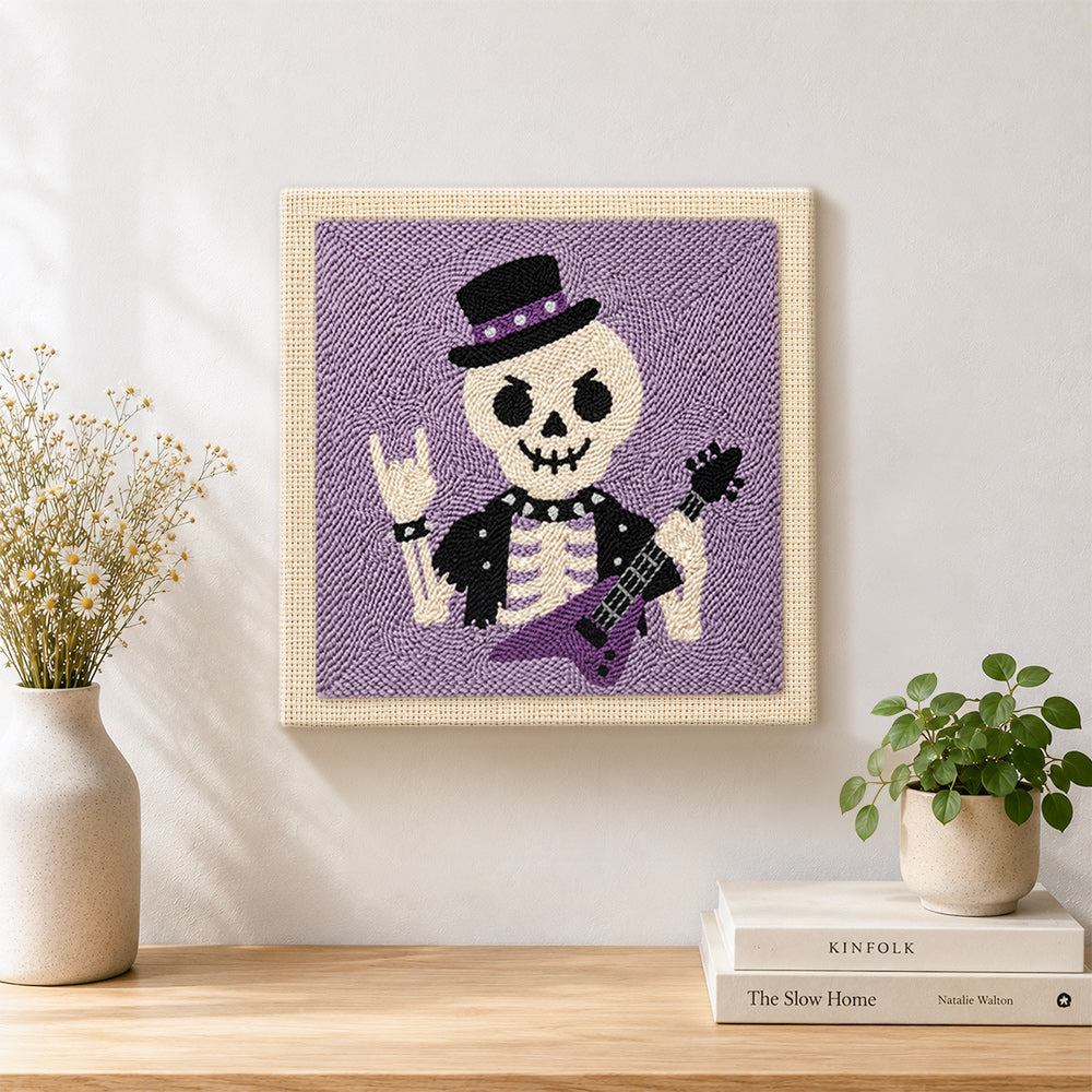 Finished rocker skeleton artwork displayed on a wall