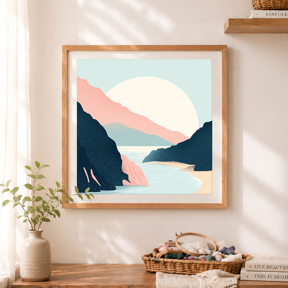 Finished rocky coastal cove cross stitch artwork displayed as home decor