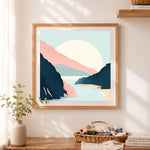 Finished rocky coastal cove cross stitch artwork displayed as home decor